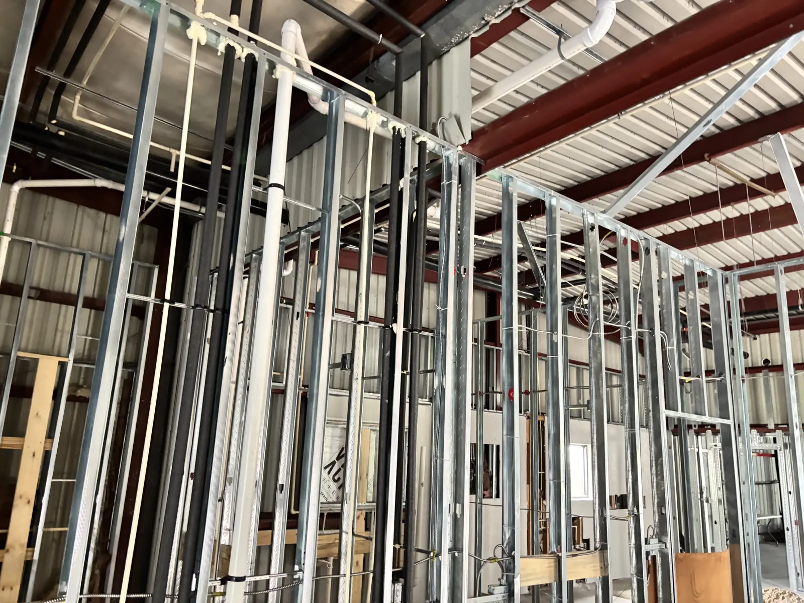 Metal stud partitions framed out inside an existing metal building shell